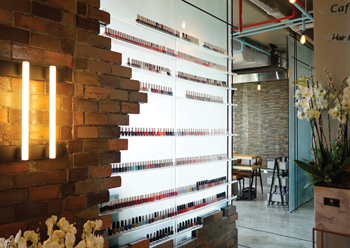 Nail polish shelves combine bricks with glass.