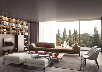 The Spazioteca bookcase with TV panel acts as a backdrop to the Time sofa.