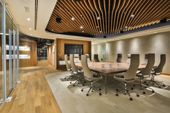 Curved wooden ceiling panels and wooden oak floors ... inspired by Dubai’s shifting sand dunes.