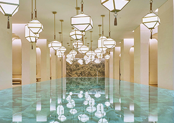 The indoor swimming pool ... based on a modern colonnade, lit by dozens of lanterns.