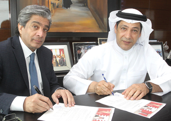 Dr Bashar and Shehabi sign the deal. 