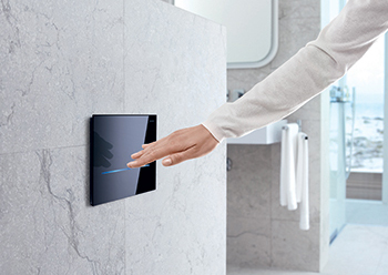 Geberit WC flush controls can be actuated automatically by a hand motion near the visible IR sensor.