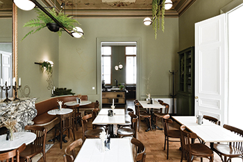 Palma horizontal pendants brightens the Petit Epicerie in Liege, Belgium.