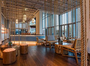 The beach club features bamboo and rope ceilings and arabesque lanterns.