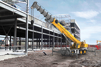 The Grove GRT9165 by Manitowoc ... the latest in its line of rough-terrain cranes.