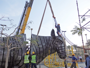 Workers putting together one of the sculptures. 