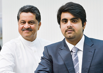 Akram (right), with his father Thumbay Moideen, the founder of the Thumbay Group.